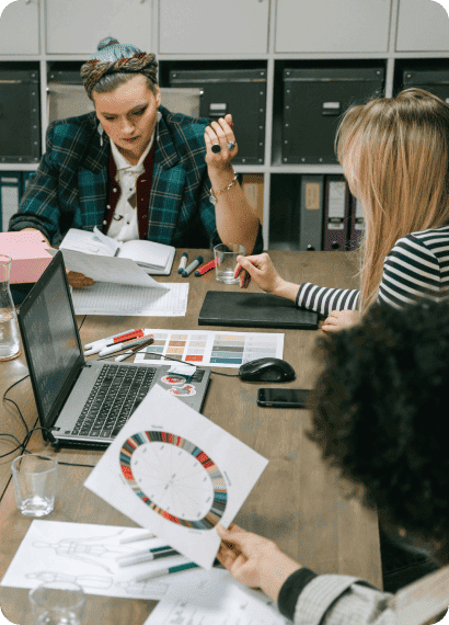 Design team reviewing colour swatches around a table